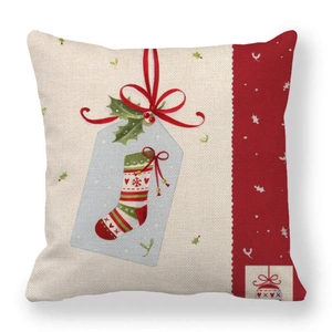 Detail of Christmas linen pillowcase showing festive stocking and red border patterns