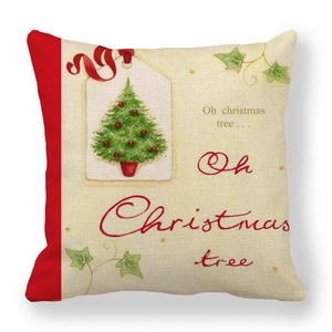 Close-up of linen Christmas tree cushion cover with red trim and holiday text