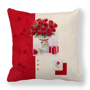 Close-up of linen Christmas pillowcase with red rose bouquet and gift box illustration