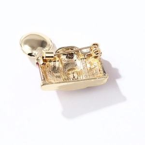 Retro camera enamel brooch in gold finish with sturdy safety pin back closure
