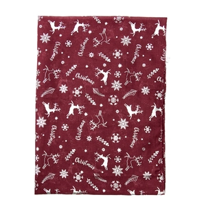 Close-up of red Christmas scarf with silver reindeer and snowflake printed patterns