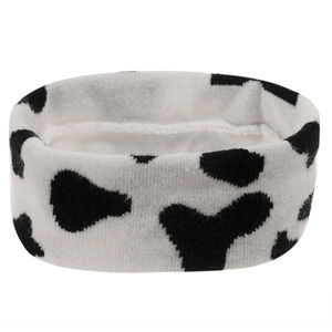 Close-up of soft cow print knitted headband for washing face or makeup routine