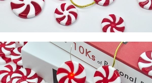 Detail of red and white spiral Christmas ornaments with warm LED lighting effects