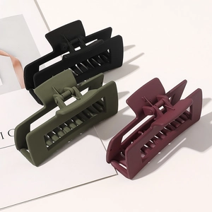 Three rectangular matte hair claws in black, dark green, and wine red with metal springs
