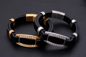 Detailed view of men's leather bracelets with gold and silver zircon-inlaid accents