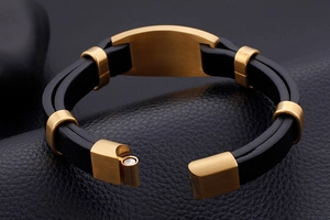 Macro shot of gold-plated stainless steel magnetic clasp on black men's leather bracelet