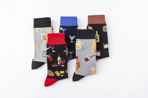 Detail shot of five pairs of men's crew socks featuring assorted beverage patterns
