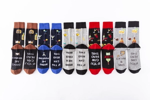 Close-up of five colorful cotton socks with funny drink-related text on the soles
