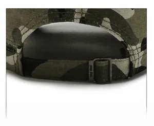 Close-up of camouflage military cap featuring a vintage metal adjustable back strap buckle