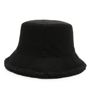 Classic black bucket hat with warm faux fur trim for autumn and winter streetwear