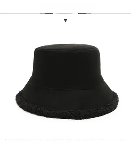 Front view of black fisherman hat with textured fleece brim and twill cotton fabric