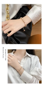 Detail of 14K gold plated bracelet with natural baroque pearls and adjustable draw-cord