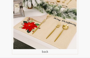 Nahaufnahme von beigem Weihnachts-Platzset mit Weihnachtsstern und Rückseite-Detail