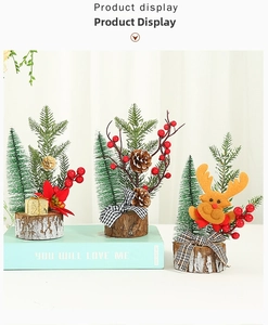 Detailed view of mini Christmas trees with pine cones, berries, and wooden bases
