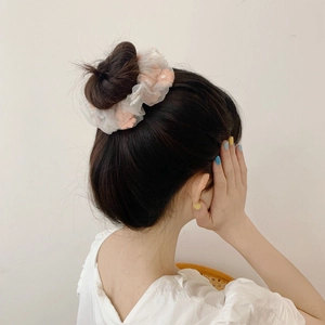 Korean style white organza hair scrunchie with pink floral embroidery on a high bun