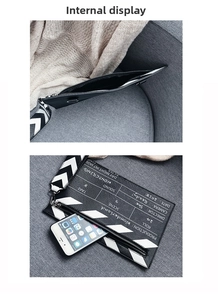 Detail of the movie clapboard clutch bag interior and printed film production elements
