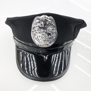 Close-up of black police captain hat featuring a shiny patent leather brim and silver badge