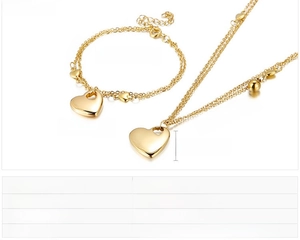 Close-up of 18K gold plated stainless steel heart necklace and bracelet jewelry set details