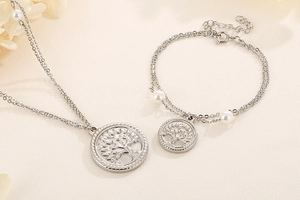 Detail of silver double-layer tree of life necklace and bracelet with white pearls