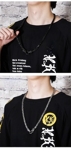 Detail of Byzantine chain necklaces in gun black and silver steel with animal head clasps