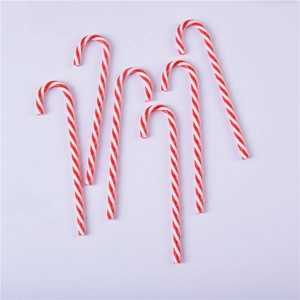 Detailed view of red and white spiral acrylic candy canes for Christmas tree decoration