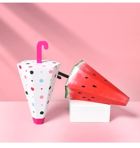 Detail of umbrella-shaped candy boxes with polka dots and watermelon patterns