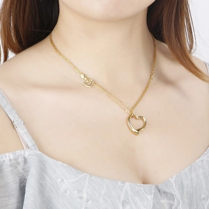 Elegant gold double-layered stainless steel necklace with two hollow heart pendants for women