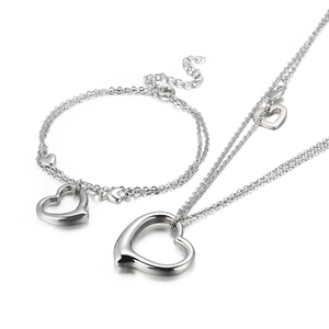 Elegant stainless steel necklace and bracelet jewelry set with hollow heart pendants