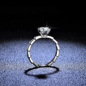 Moissanite ring with large round solitaire and geometric bamboo style silver band