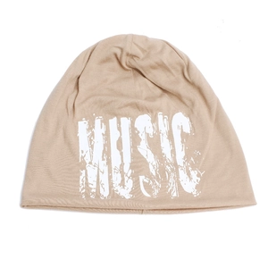 Detail of music letter print on soft beige knit beanie hat for hip-hop fashion style