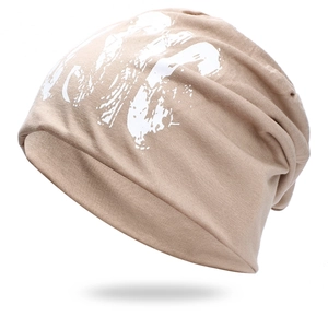 Chic light brown knit beanie hat with artistic white music letter graffiti print