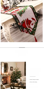 Detailed Christmas table runner featuring red and green festive patterns with red tassels