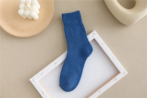 Detailed close-up of dark blue thermal cotton crew socks with elastic ribbed cuffs