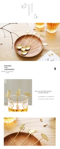 Macro view of gold 304 stainless steel cat shaped coffee spoons with hanging hooks