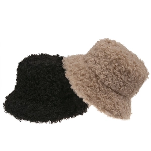 Winter faux shearling bucket hats in black and light brown colors with fluffy texture