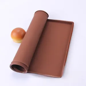 Close-up of flexible brown food-grade silicone baking mat with non-slip texture