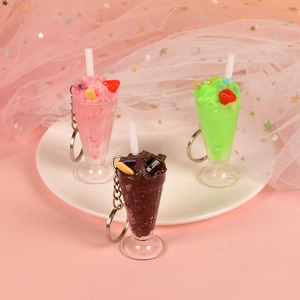 Realistic mini ice cream sundae keychains in pink, green, and purple for bag decor