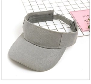 Detail of grey sun visor hat with twill cotton texture and adjustable strap back