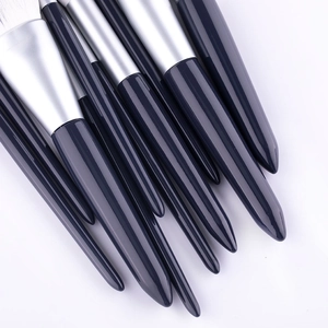 Set di 10 pennelli da trucco professionali con manici blu scuro e setole bianche morbide