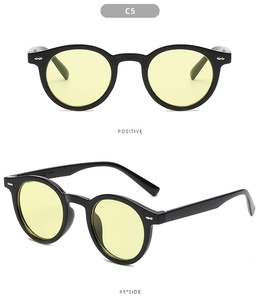 Detailed views of retro round black sunglasses with yellow lenses and silver rivets