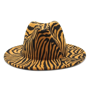 Detailed view of yellow and black tiger print pattern on wide brim wool felt fedora hat