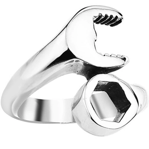 Detailed macro shot of vintage stainless steel wrench ring showing industrial metal texture