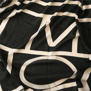 Classic black and white geometric scarf with artistic knitted letter patterns for women