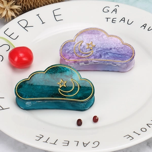 Cloud-shaped acrylic hair claws with marble texture and golden star moon patterns
