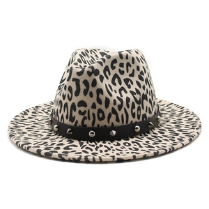 Detail of leopard print jazz fedora with black leather band and metal rivet studs