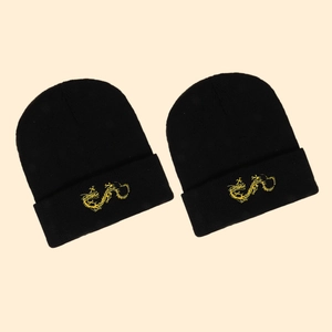 Winter black knit beanie with gold dragon embroidery featuring a classic cuffed design