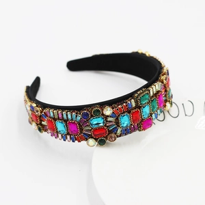 Close-up of Baroque headband with colorful rhinestones and crystals on black satin