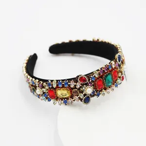 Detailed macro view of a Baroque headband with colorful rhinestones and white pearls