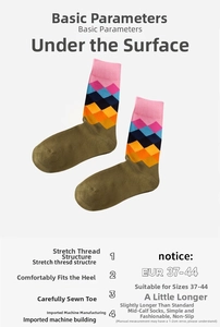 Detail of olive green mid-calf socks with argyle pattern and elastic ribbed cuffs