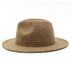 Close-up of the fine brown houndstooth wool fabric and texture on a retro fedora hat